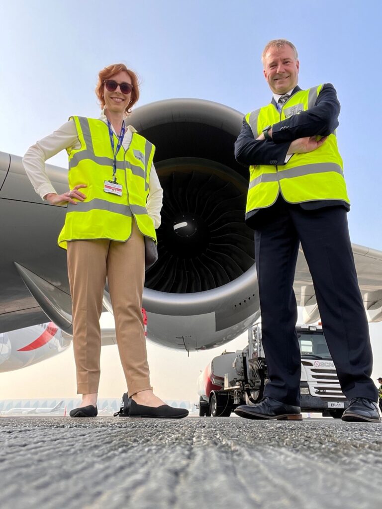 Bob Rozmiarek poses for a photo with two flight attendants prior to the historic Virgin Atlantic fligh